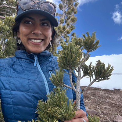 Sachi Srivastava standing outside in the trees