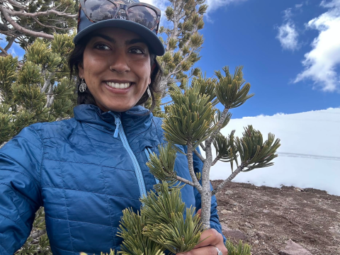 Sachi Srivastava standing outside in the trees