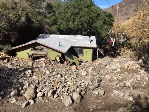postfire debris flow into house