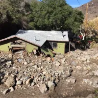 postfire debris flow into house
